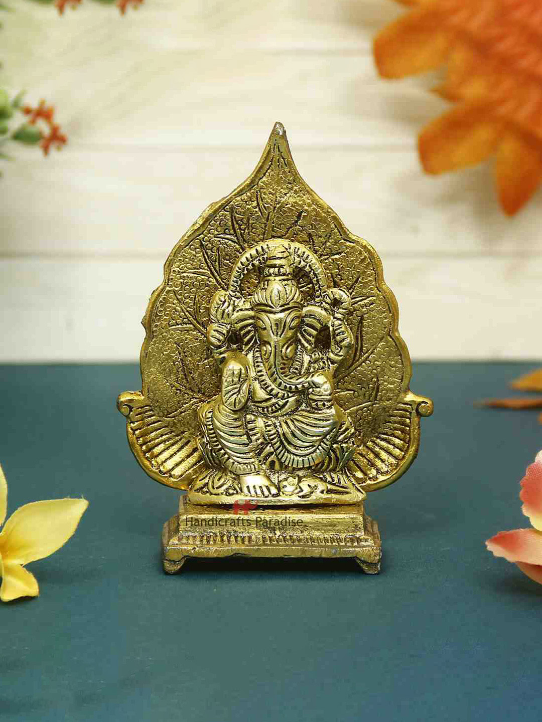 

HANDICRAFTS PARADISE Gold-Toned Ganeshsa with leaf Metal Showpiece