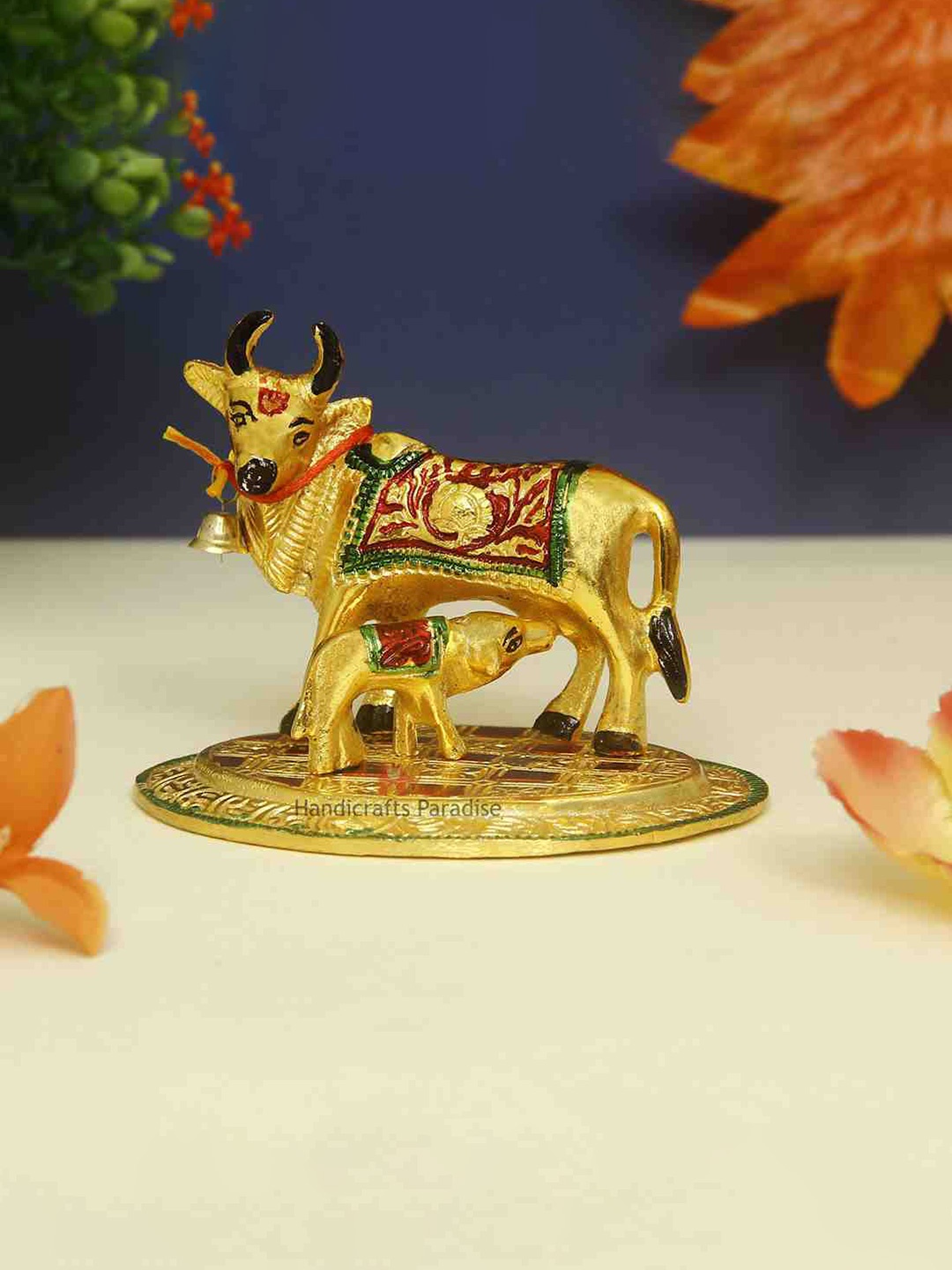 

HANDICRAFTS PARADISE Gold-Toned Cow baby Showpiece