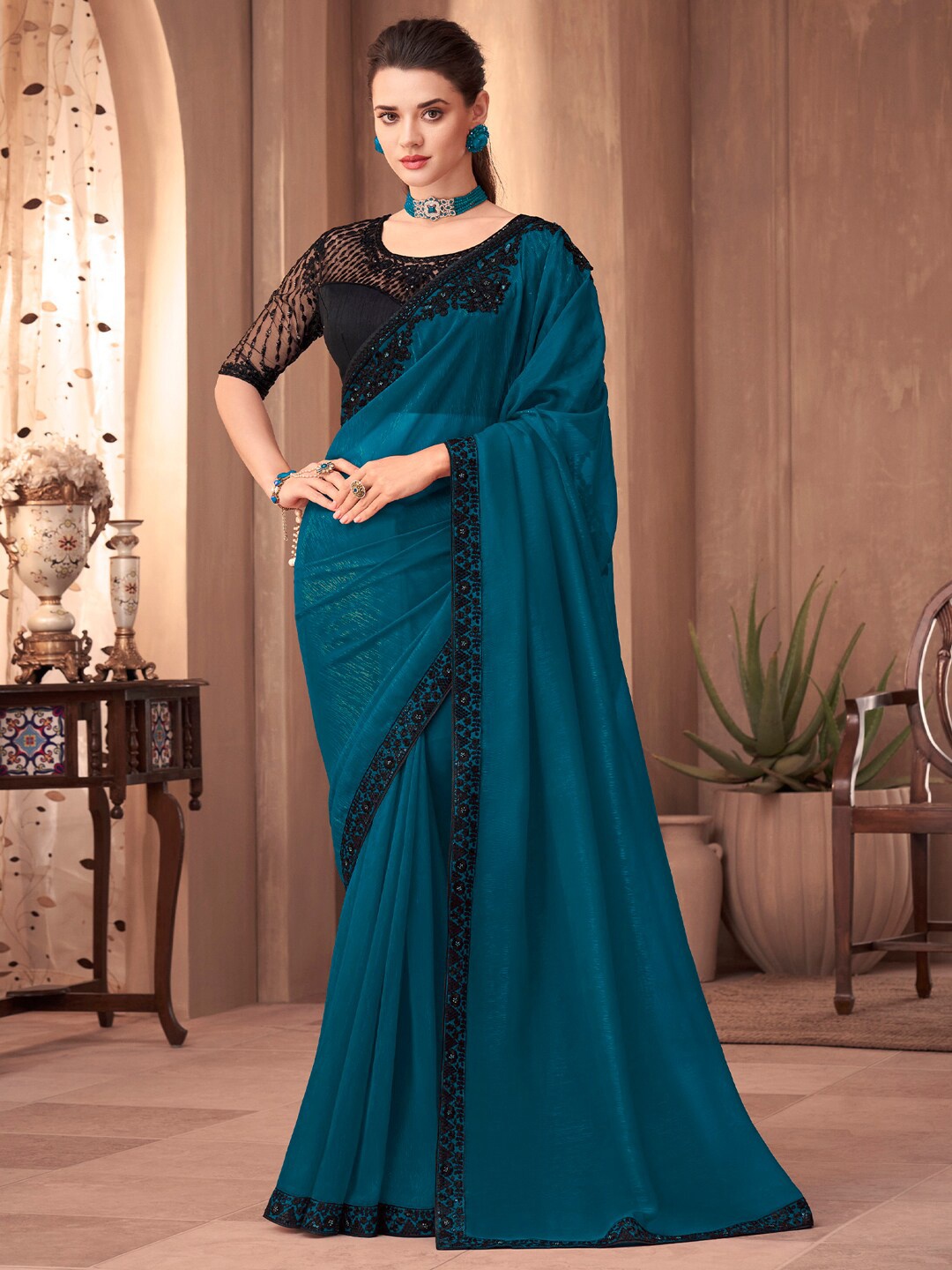 

Mitera Teal Green Sequinned Pure Georgette Saree