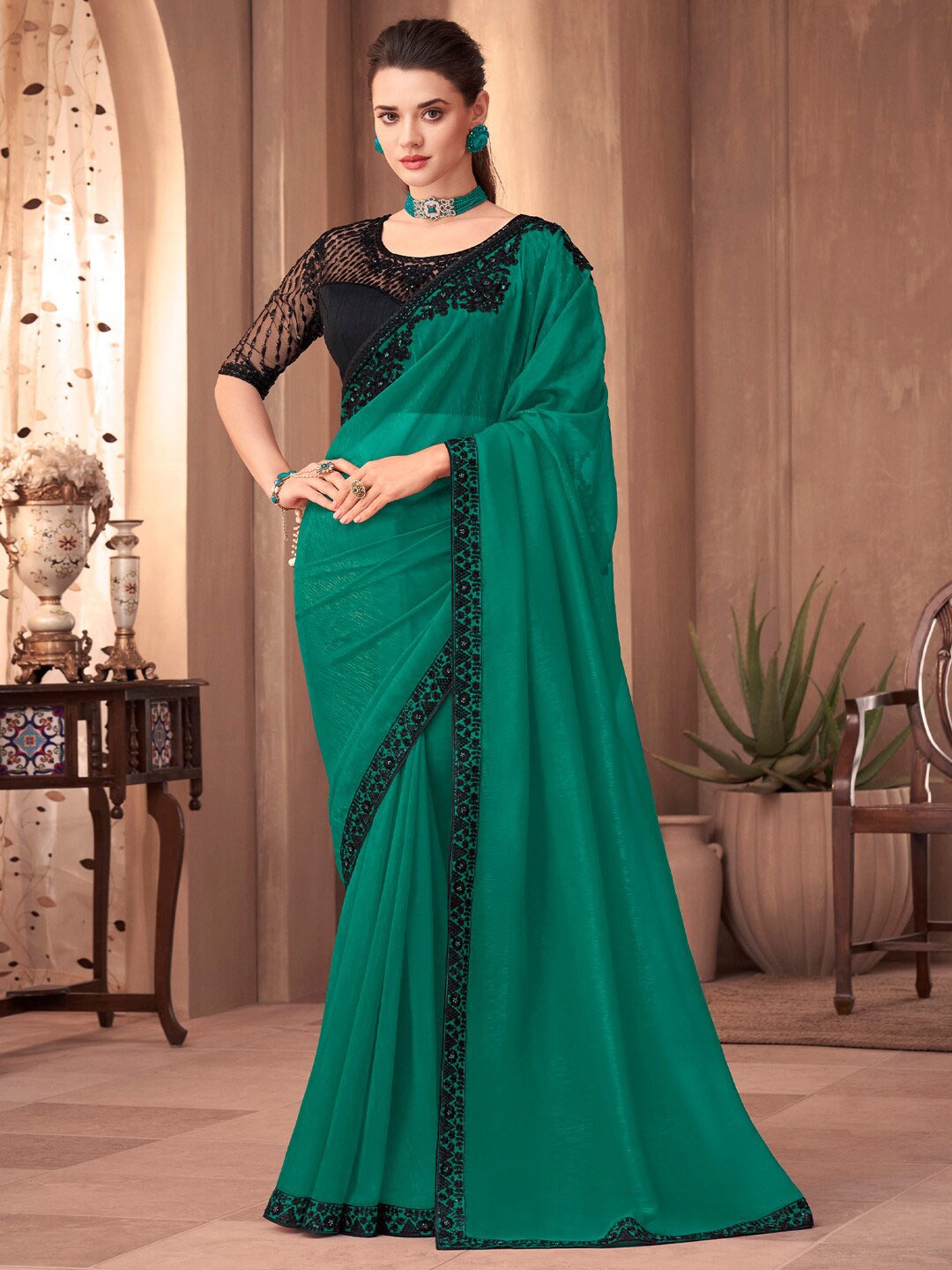 

Mitera Green Sequinned Pure Georgette Saree