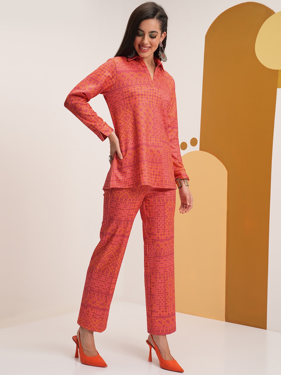 

Vishudh Geometric Printed Shirt Collar Tunic With Trousers, Orange