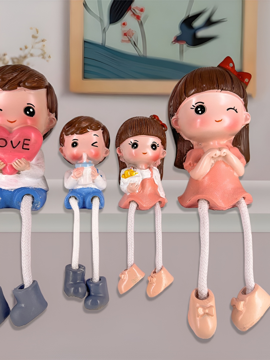 

Elegant Lifestyle Peach & Blue Hanging Leg Family Figurine Showpiece