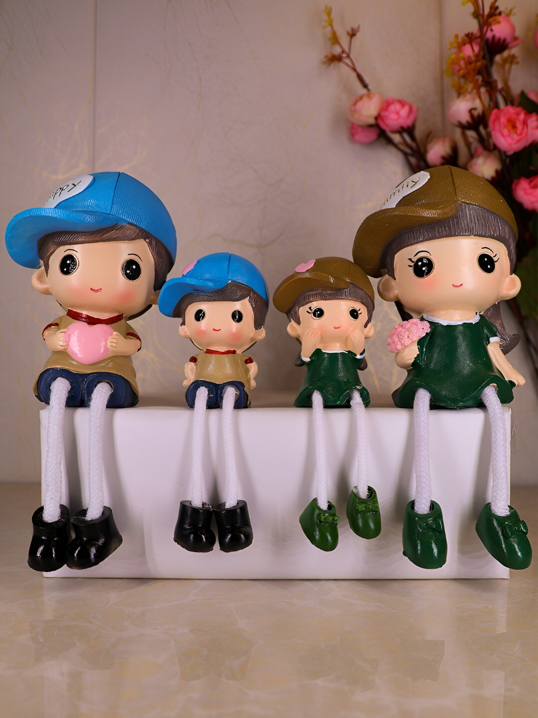 

Elegant Lifestyle Green & Beige Hanging Leg Family Figurine Showpiece
