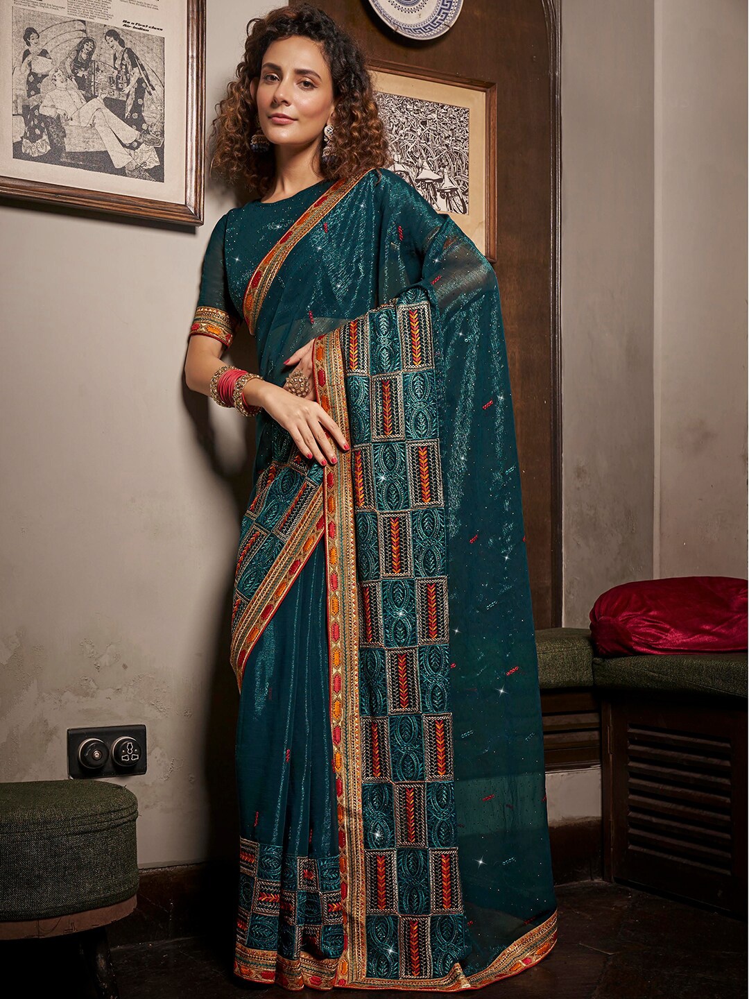

Mitera Teal Blue & Red Ethnic Motifs Embroidered Pure Chiffon Saree