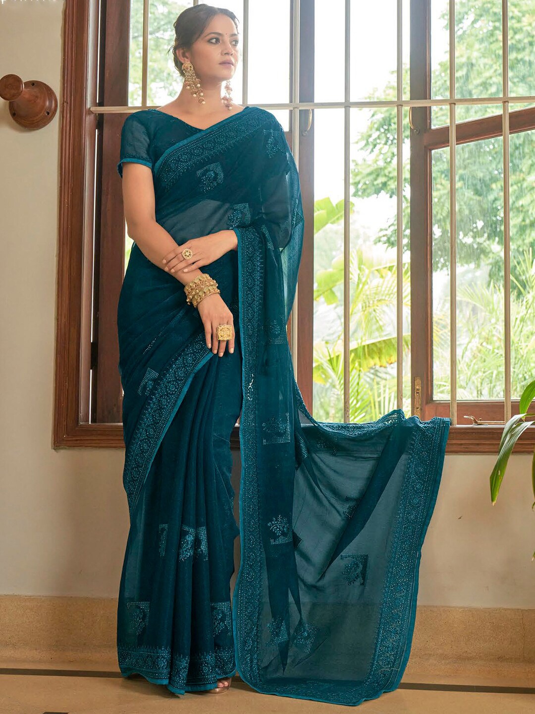 

Mitera Teal Ethnic Motifs Embroidered Pure Chiffon Saree