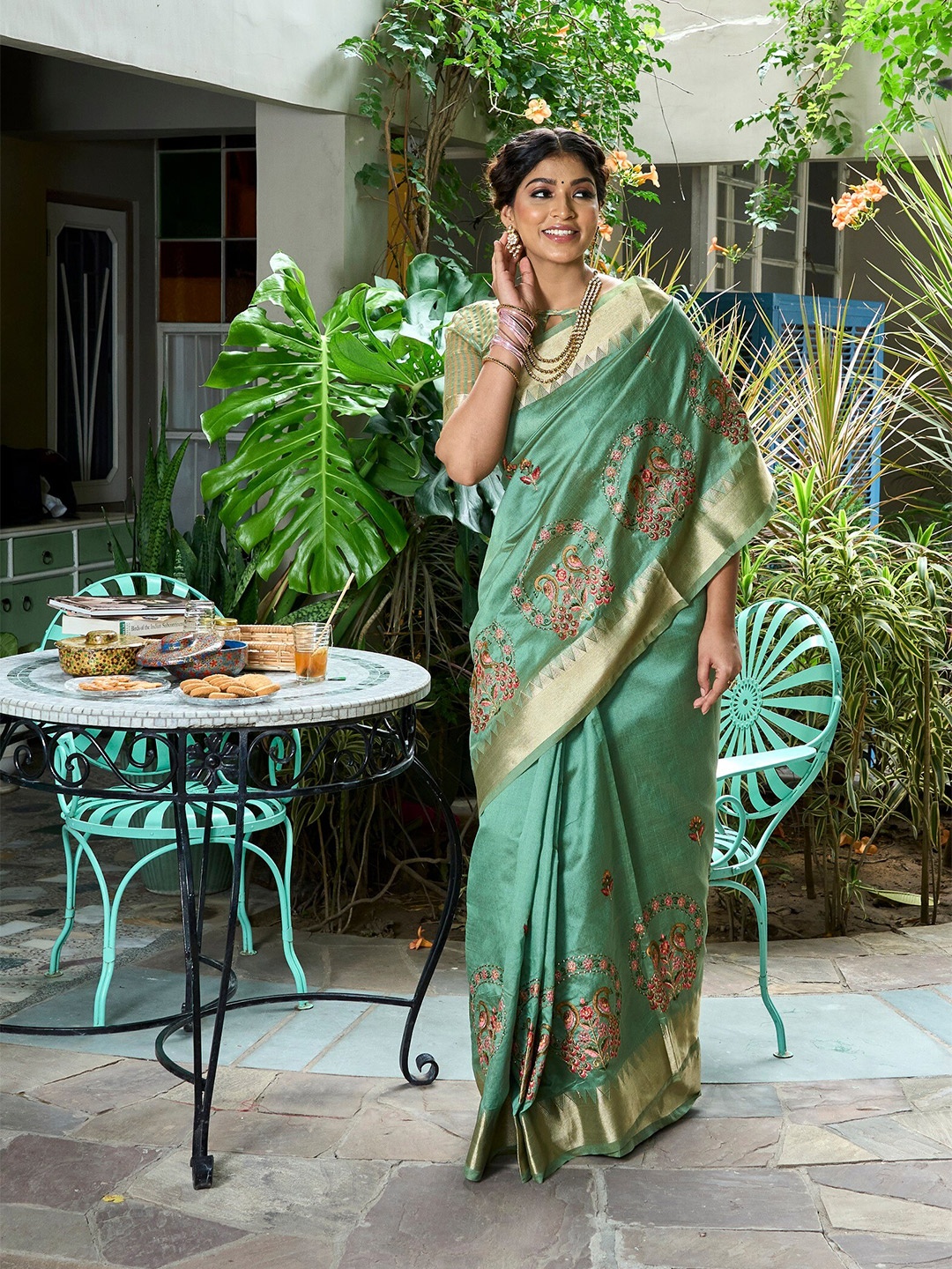 

Mitera Green Floral Embroidered Zari Assam Silk Cotton Banarasi Saree