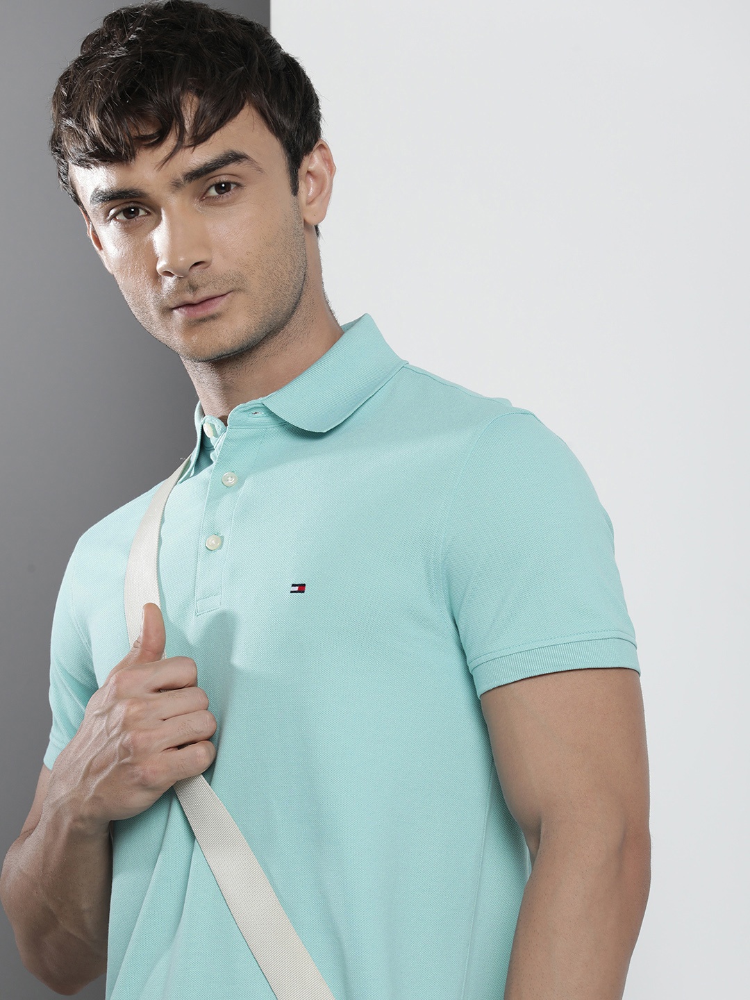 

Tommy Hilfiger Men Solid Polo Collar Indigo Knitted Slim Fit T-shirt, Turquoise blue
