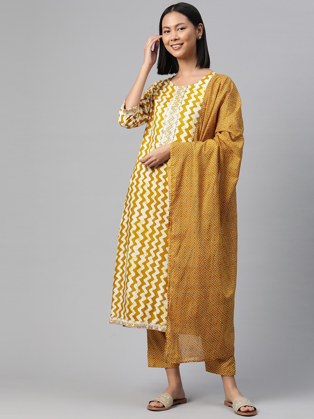 

Readiprint Abstract Printed Mirror Work Kurta with Trousers & Dupatta, Mustard