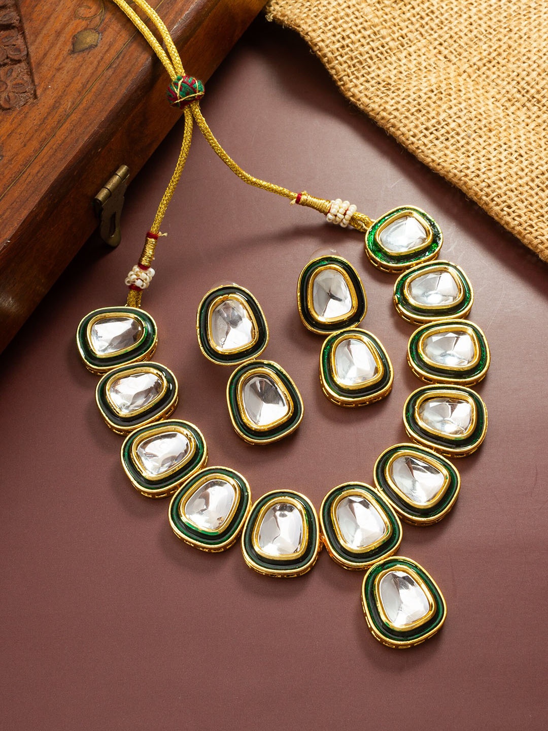 

aadita Gold Plated Kundan Studded Jewellery Set