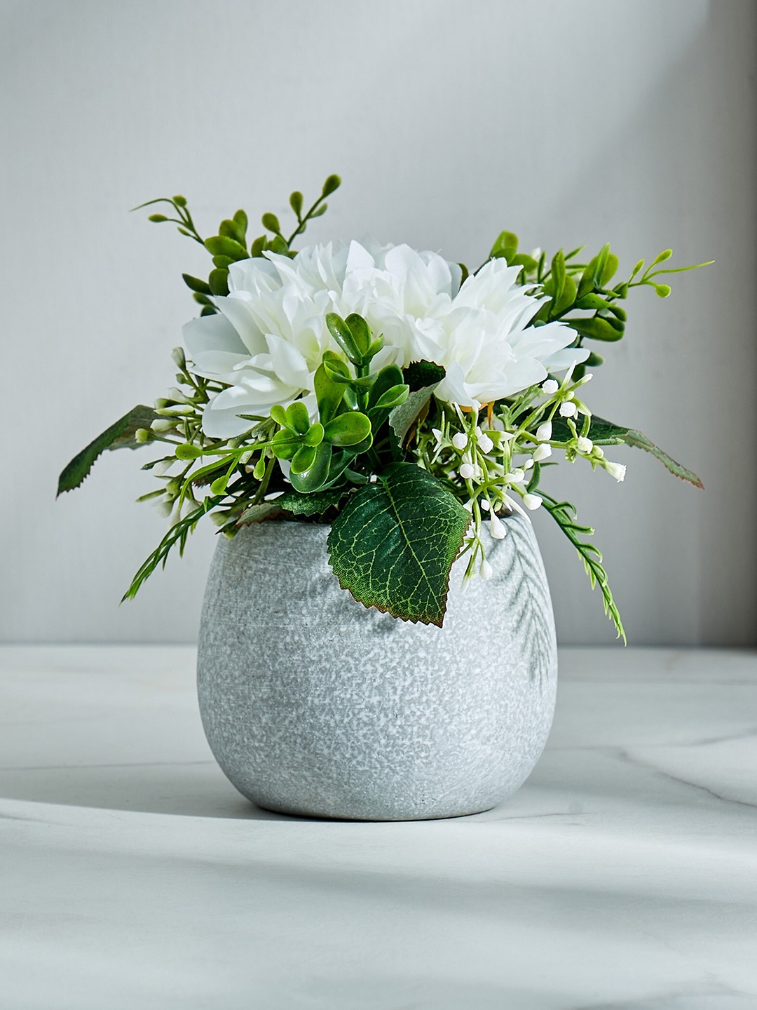 

Home Centre White Gloria Artificial Flower With Pot