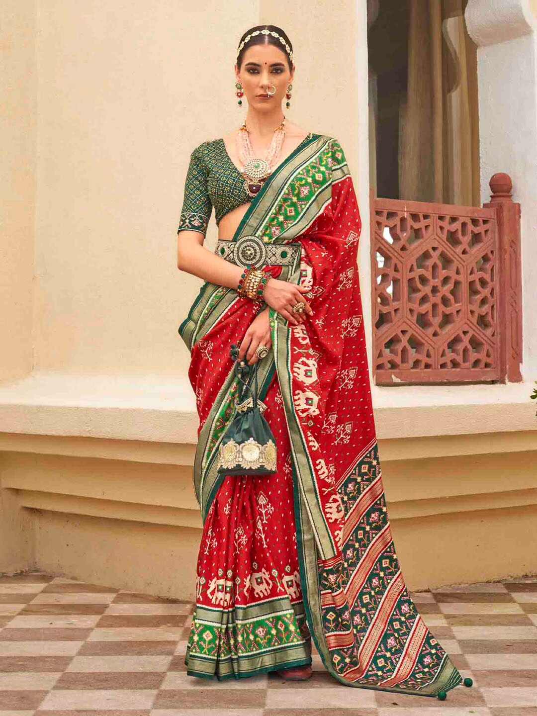 

Anouk Red Ethnic Motifs Printed Zari Patola Saree