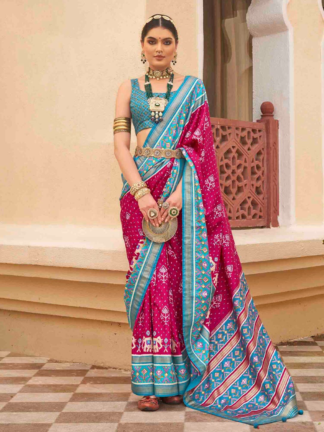 

Anouk Pink Ethnic Motifs Printed Zari Patola Saree