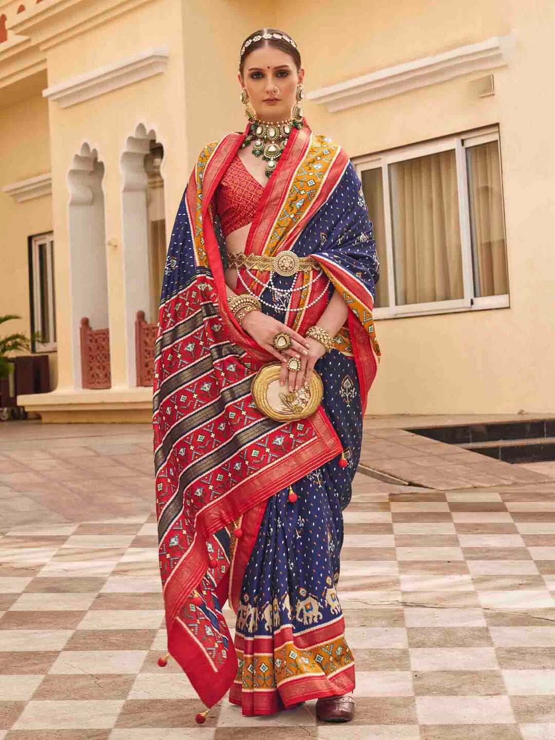

Anouk Navy Blue Ethnic Motifs Printed Zari Patola Saree