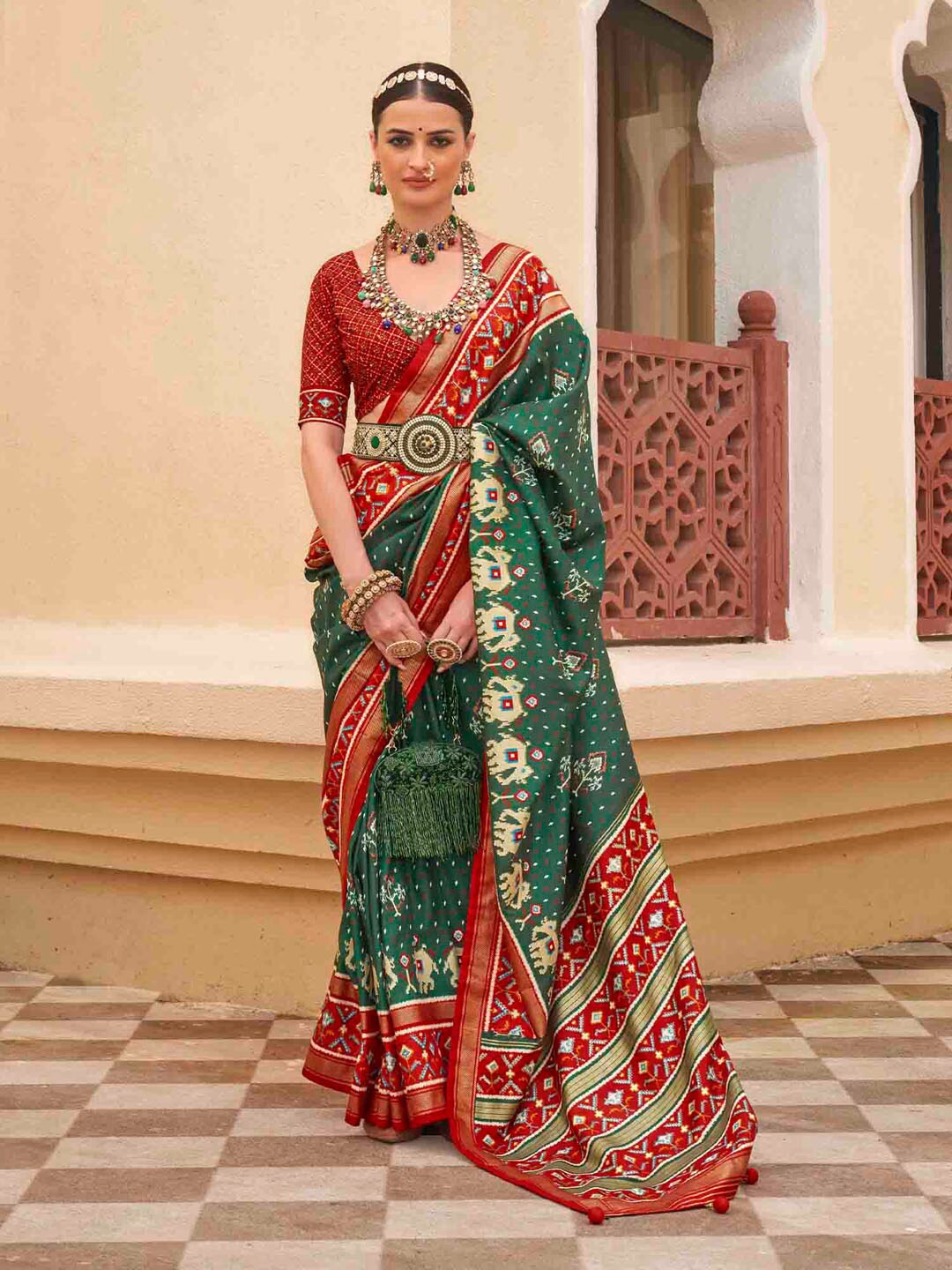 

Anouk Green Ethnic Motifs Printed Zari Patola Saree