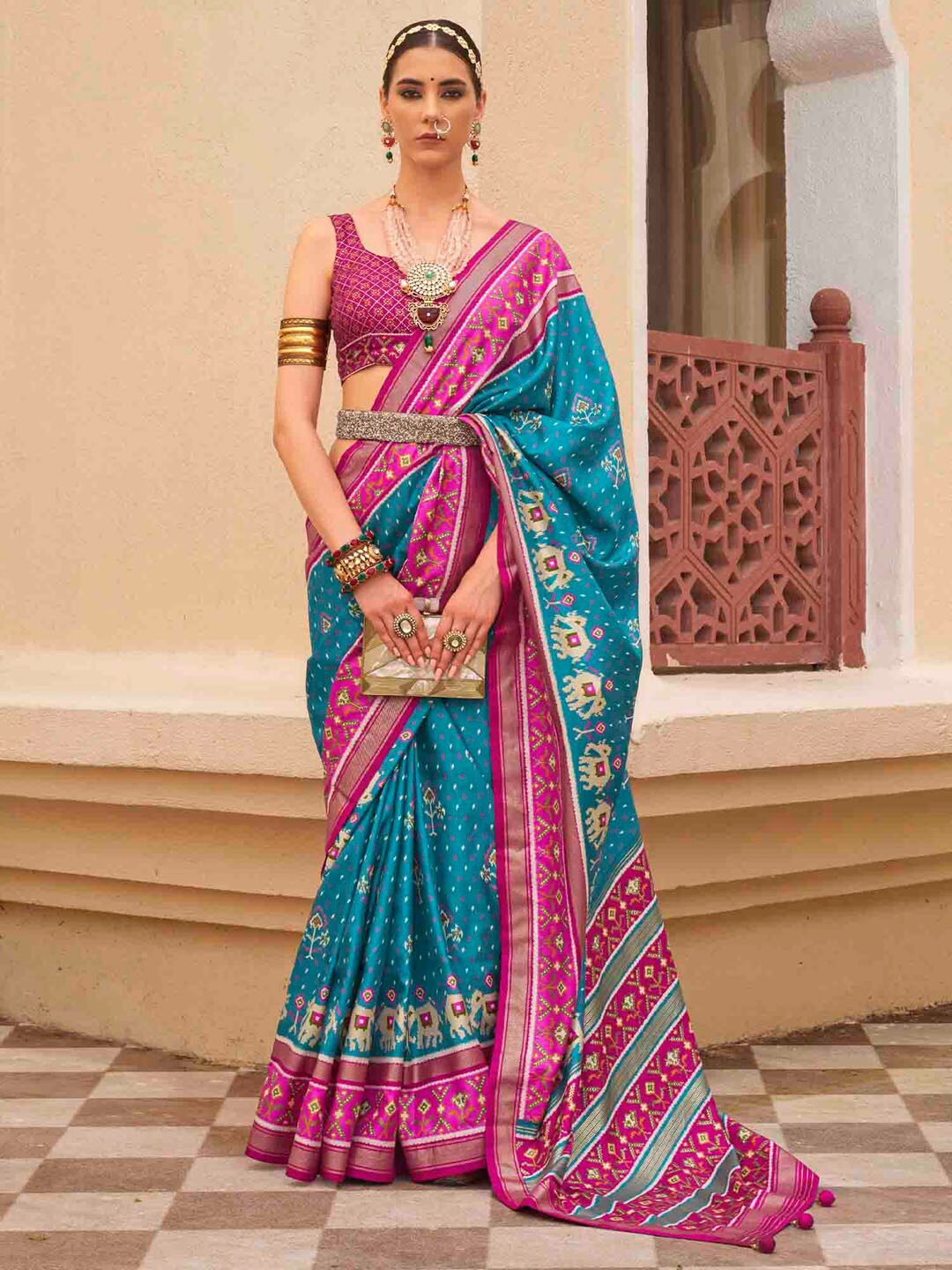 

Anouk Blue Ethnic Motifs Printed Zari Patola Saree