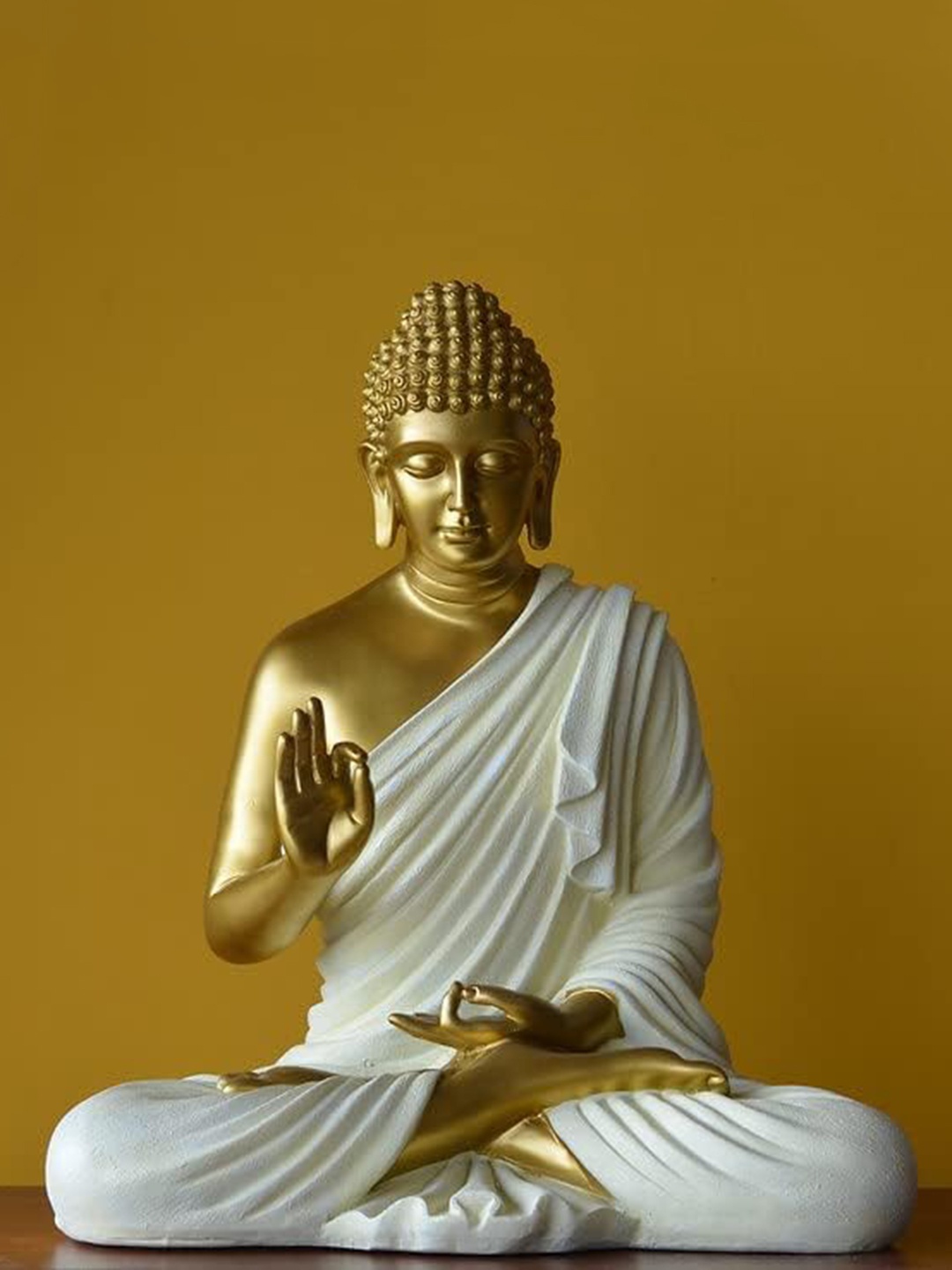 

SwarnHouse Decors Gold Toned & White Buddha Idol Showpiece