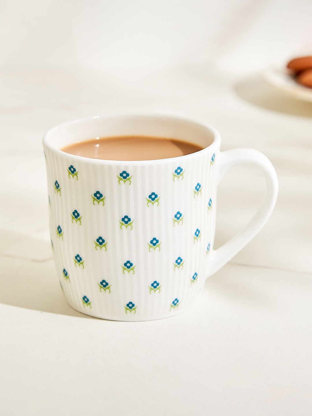 

Home Centre Raisa White & Blue Floral Printed Bone China Mug 240 ML
