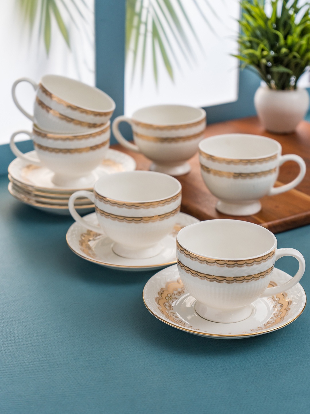 

CLAY CRAFT White & Gold Toned 12 Pieces Printed Ceramic Glossy Cups and Saucers 180 ml