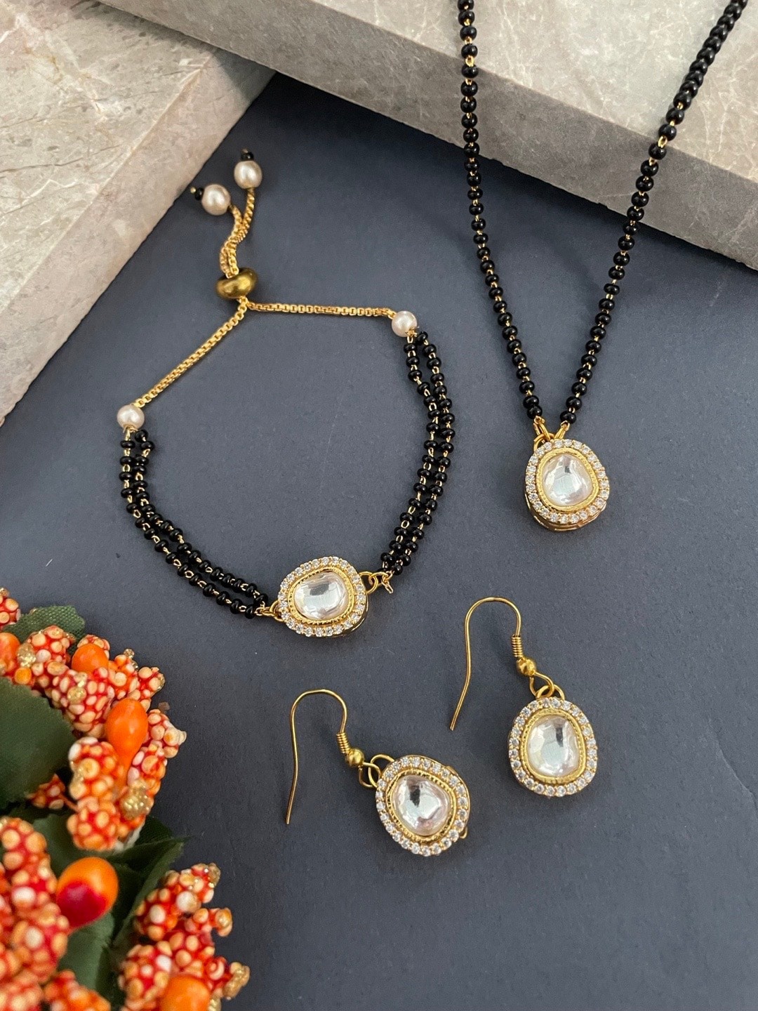 

Digital Dress Room Gold Plated Beaded Mangalsutra With Earrings & Bracelets