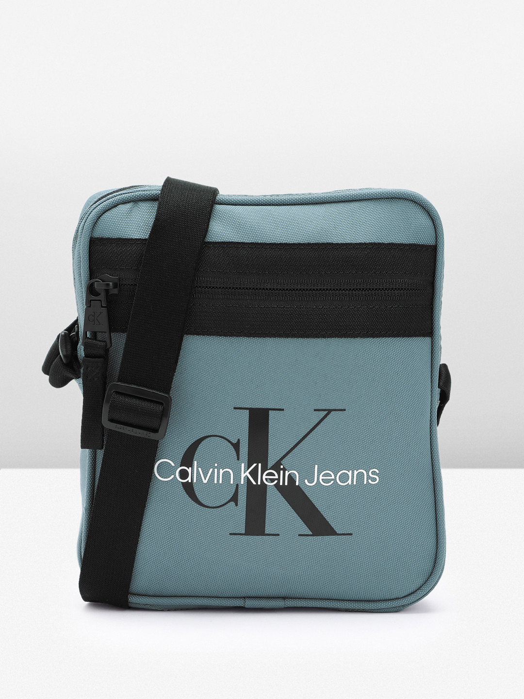 

Calvin Klein Men Brand Logo Printed Messenger Bag, Blue