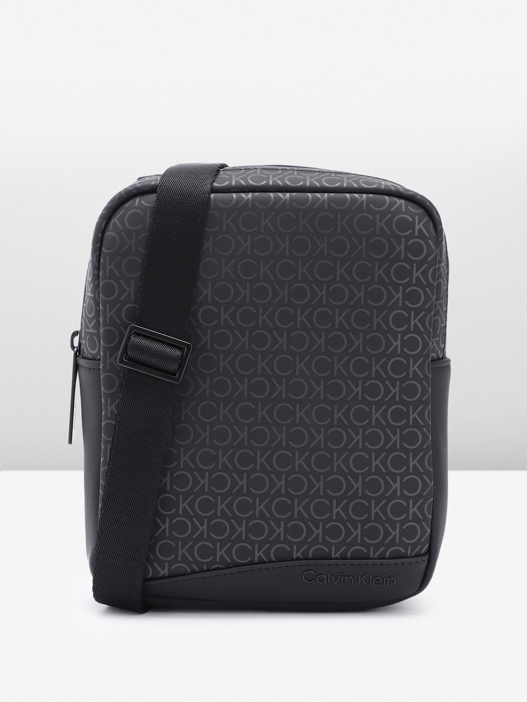 

Calvin Klein Men Brand Logo Printed Messenger Bag, Black