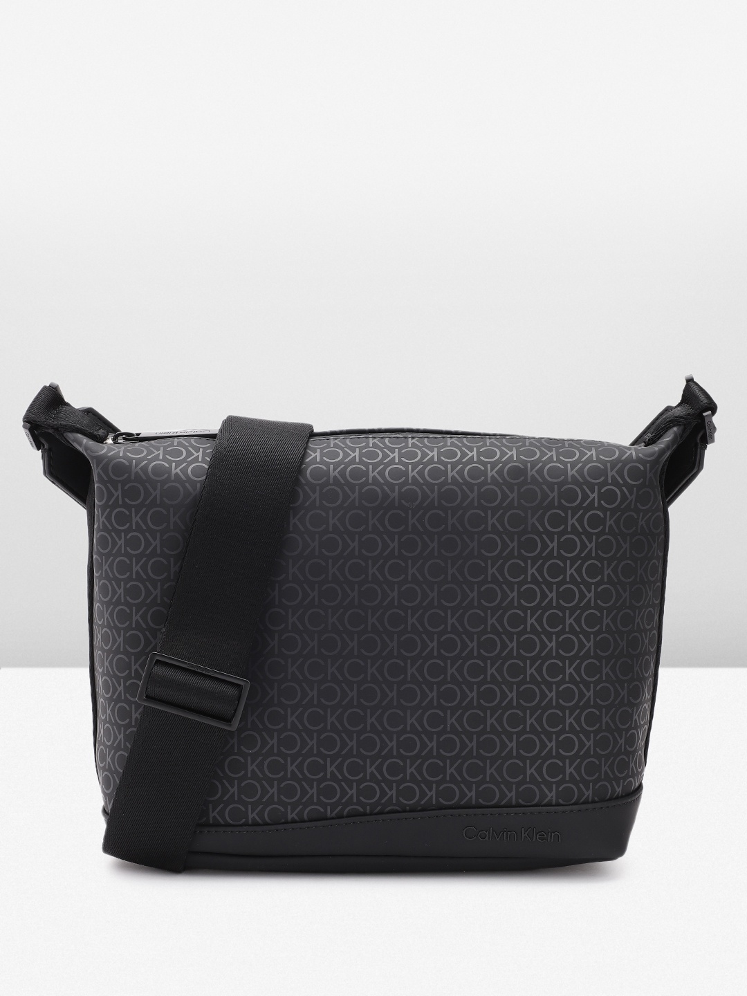 

Calvin Klein Men Brand Logo Printed Messenger Bag, Black
