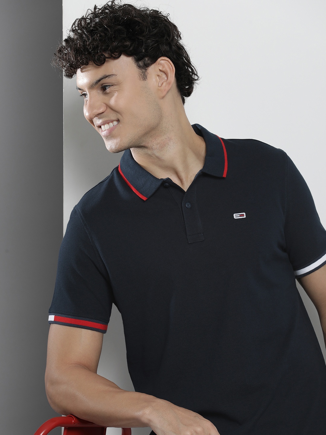 

Tommy Hilfiger Men Solid Polo Collar Indigo Knitted Pure Cotton T-shirt, Navy blue