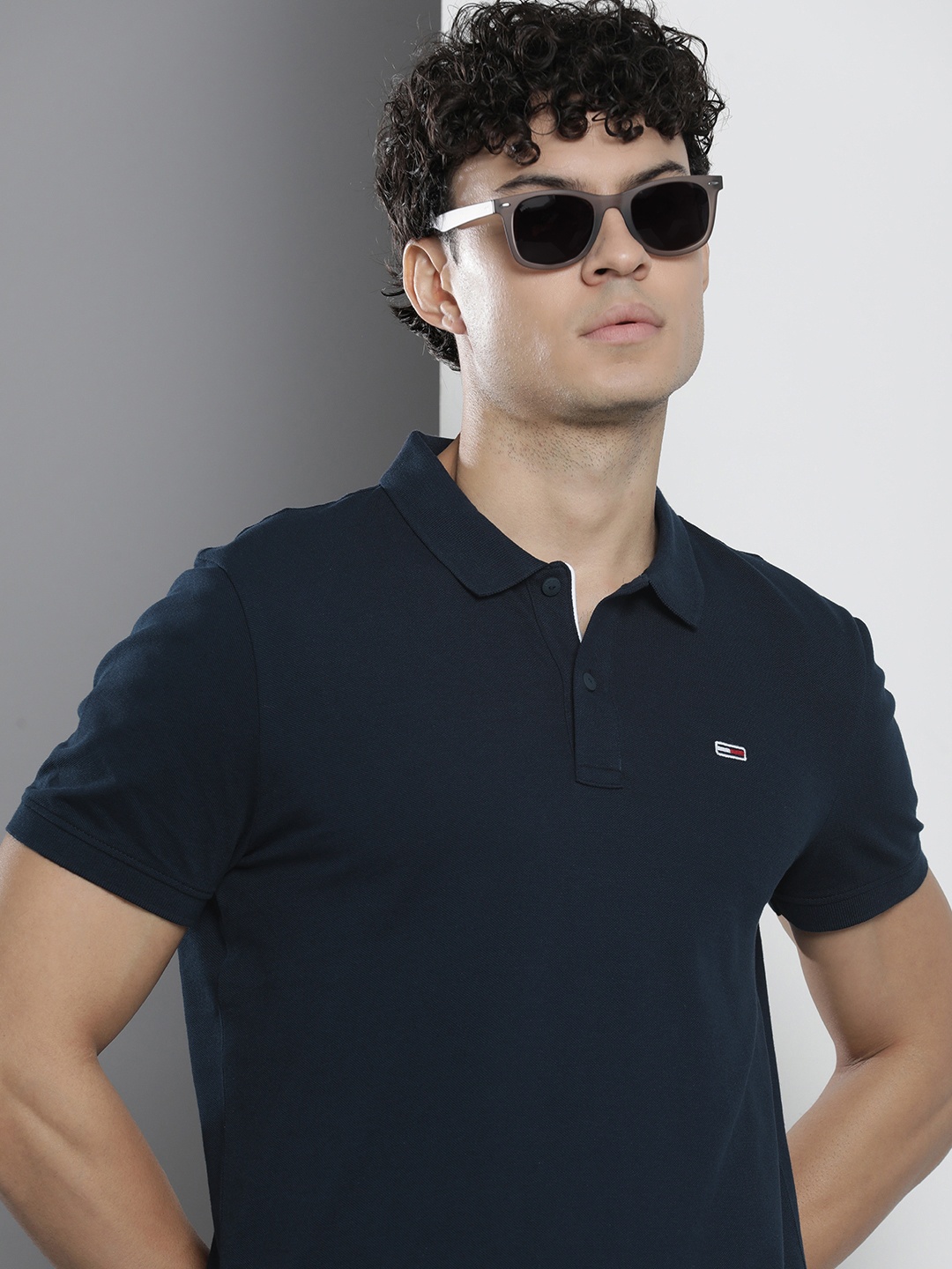 

Tommy Hilfiger Men Solid Polo Collar Indigo Pure Cotton Slim Fit T-shirt, Navy blue