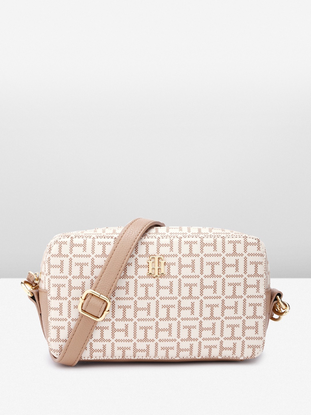 

Tommy Hilfiger Brand Logo Textured Structured Sling Bag, Beige