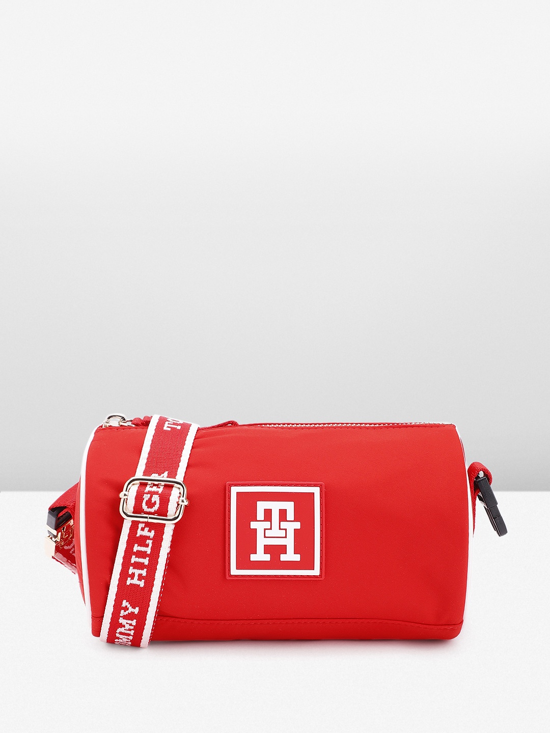 

Tommy Hilfiger Solid Bowling Sling Bag with Brand Logo Applique Detail, Red