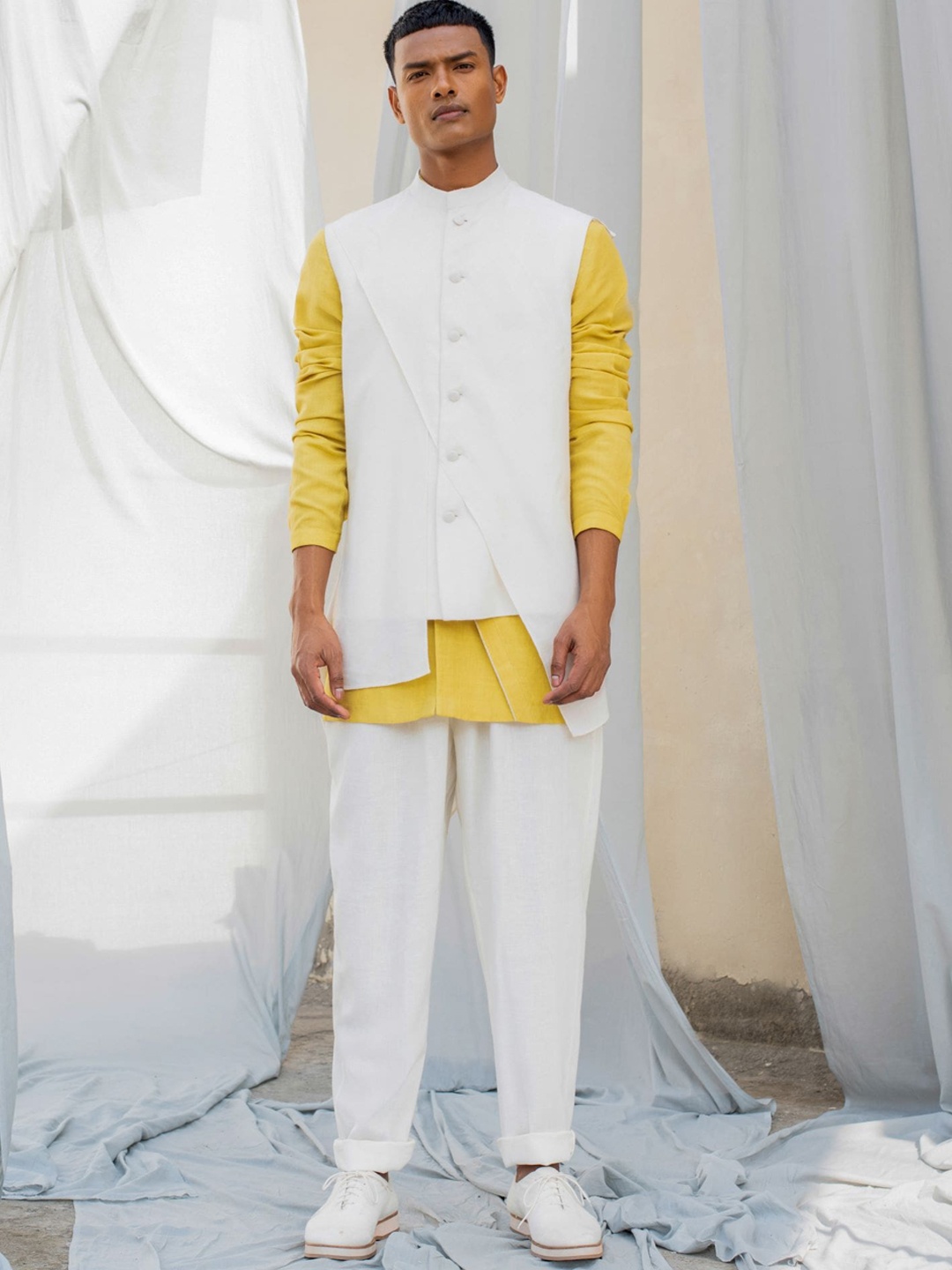 

Antar-Agni Mandarin Collar Straight Linen Kurta with Pyjama Pants with Saint Waistcoat, Off white