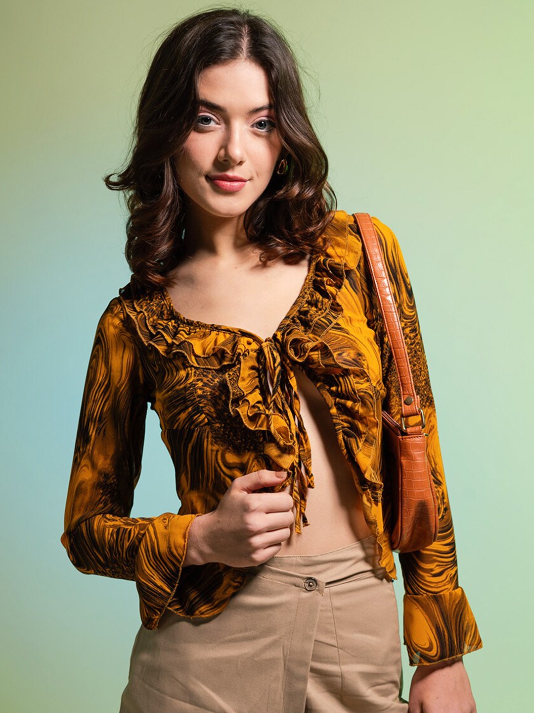 

Stylecast X Hersheinbox Mustard Yellow Abstract Printed V-Neck Georgette Top