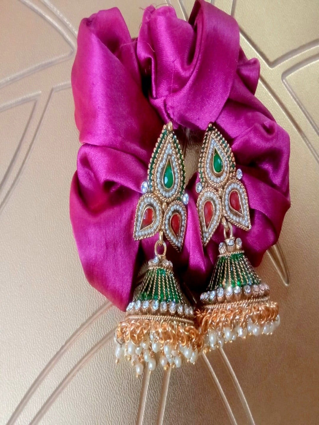 

Runjhun Gold Plated Artificial Stones Leaf Shaped Jhumkas