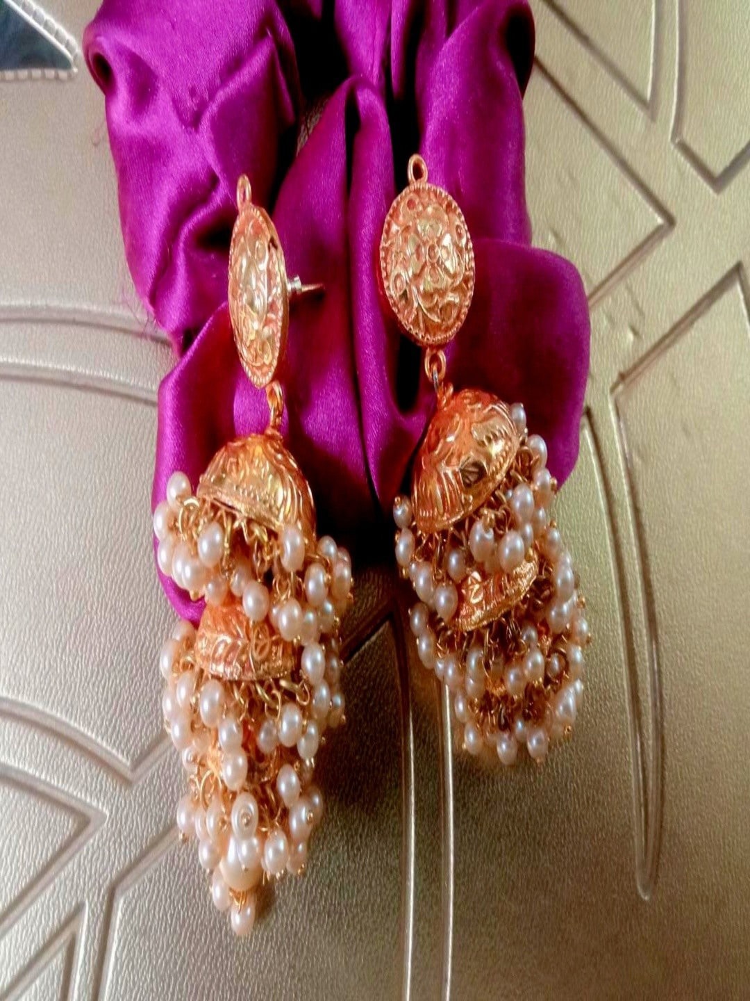 

Runjhun Gold-Plated Artificial Stones Studded Jhumkas