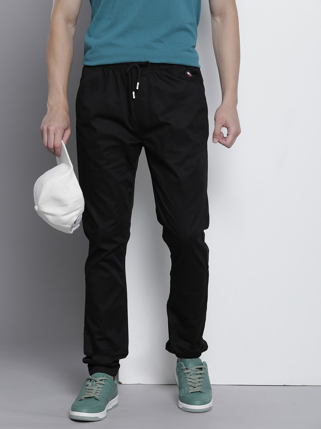 

Tommy Hilfiger Men Slim Fit Solid Mid-Rise Joggers, Black