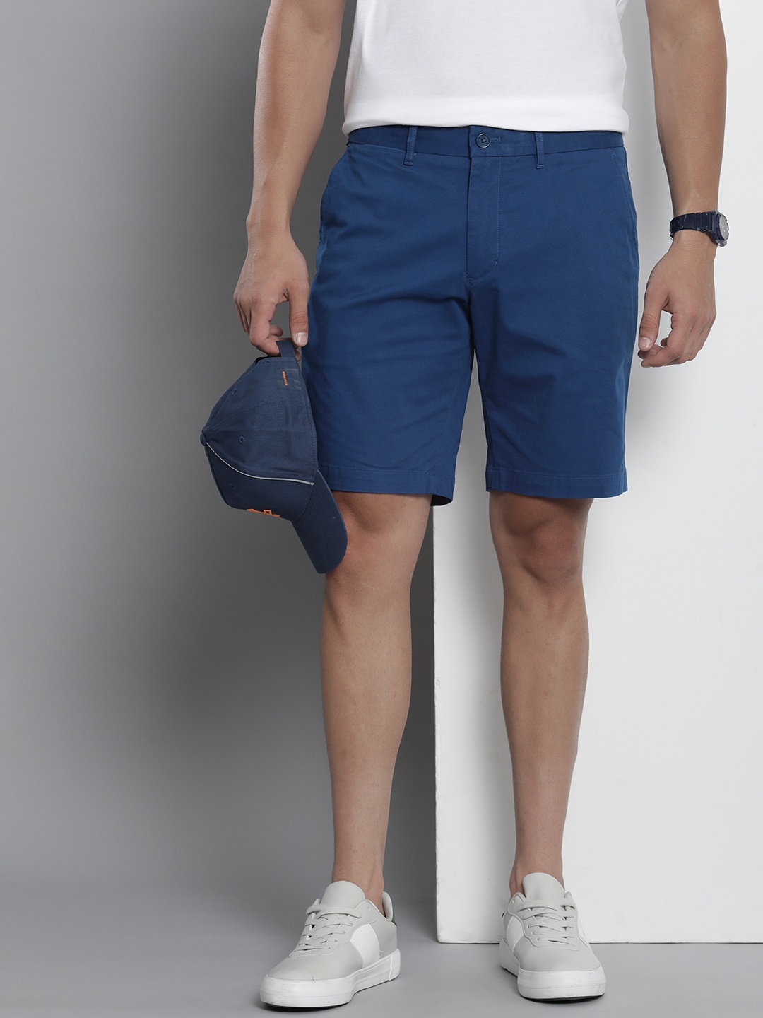 

Tommy Hilfiger Men Mid Rise Solid Regular Shorts, Blue