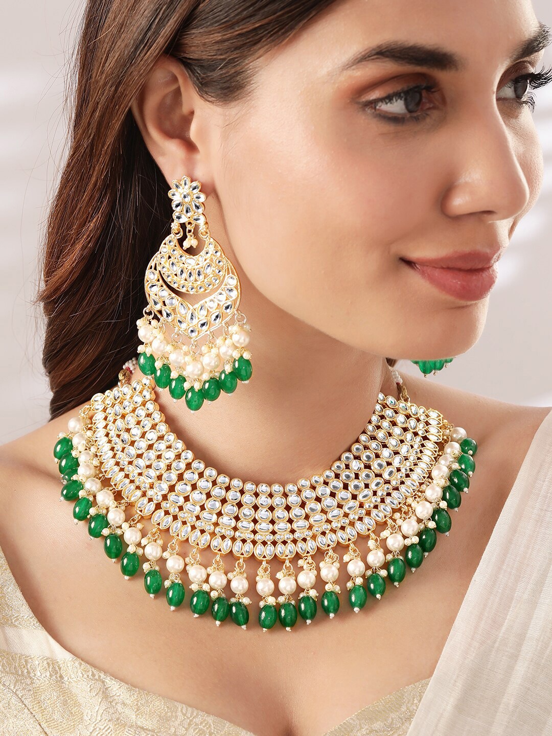 

Rubans 22K Gold Plated Kundan Stone Studded Pearl & Green Beaded Choker Jewellery Set