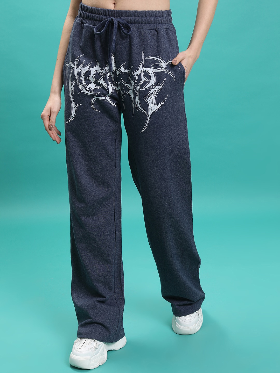 

Tokyo Talkies Women Navy Blue Abstract Printed Flared Parallel Trousers