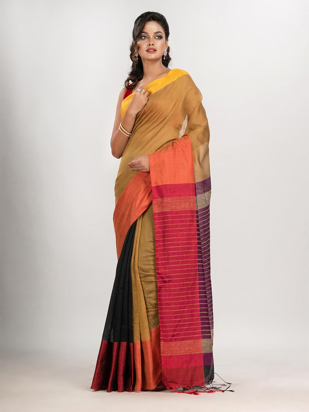 

Angoshobha Woven Design Colourblocked Saree, Mustard