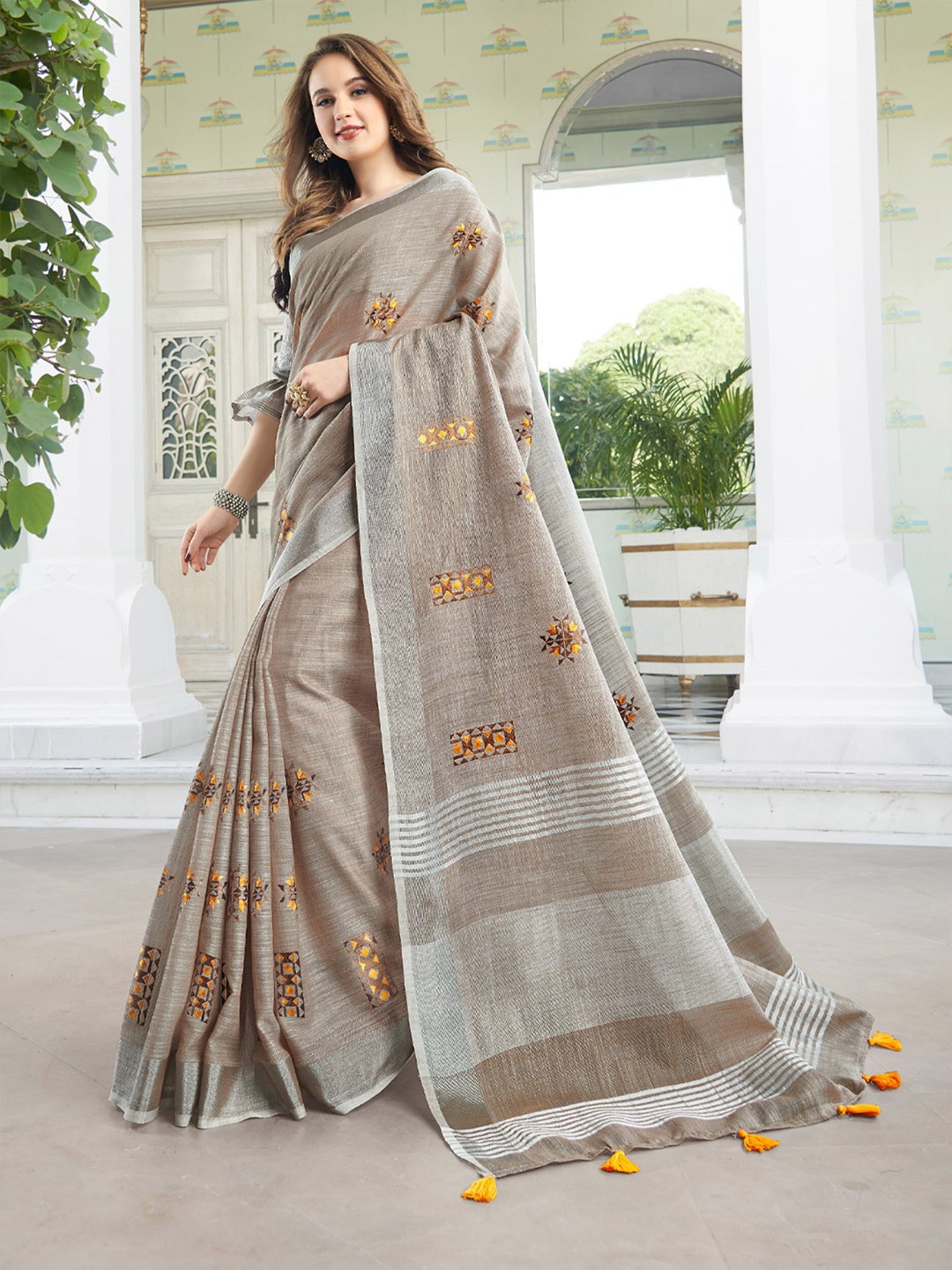 

Mitera Beige & Silver Toned Embellished Linen Embroidered Blend Designer Saree