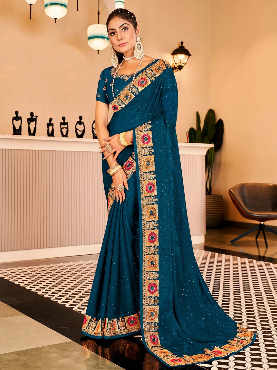 

Kalista Teal Embellished Beads and Stones Pure Chiffon Saree