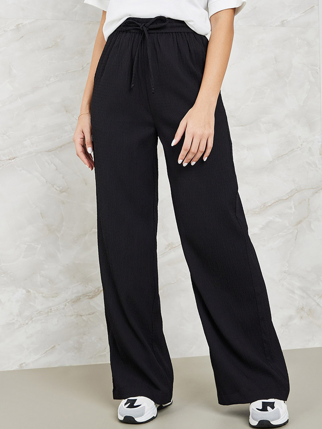 

Styli Women Black Flared High-Rise Trousers With Side Pocket