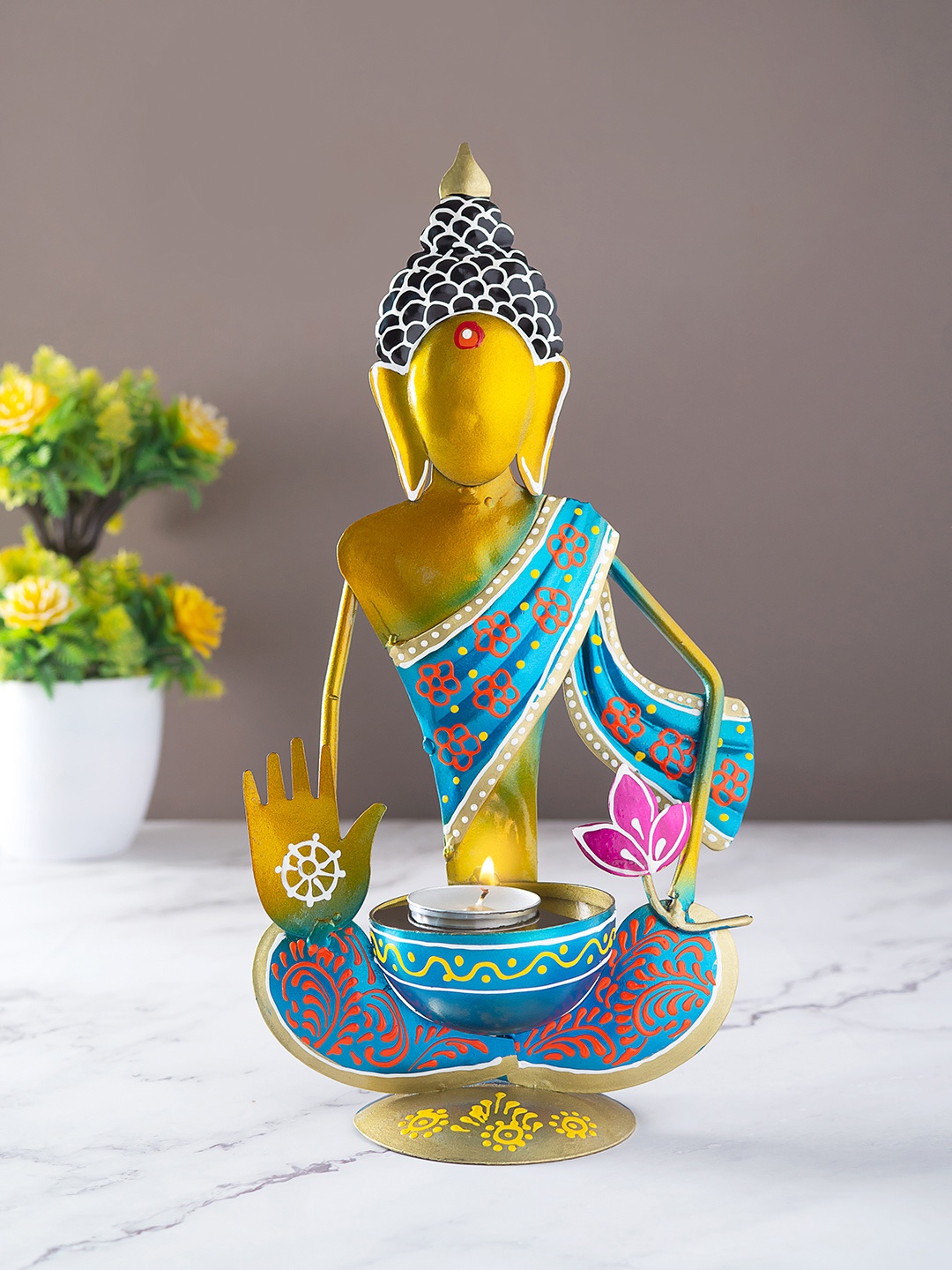 

Golden Peacock Blue & Gold Toned Printed Buddha Shaped Candle Holder