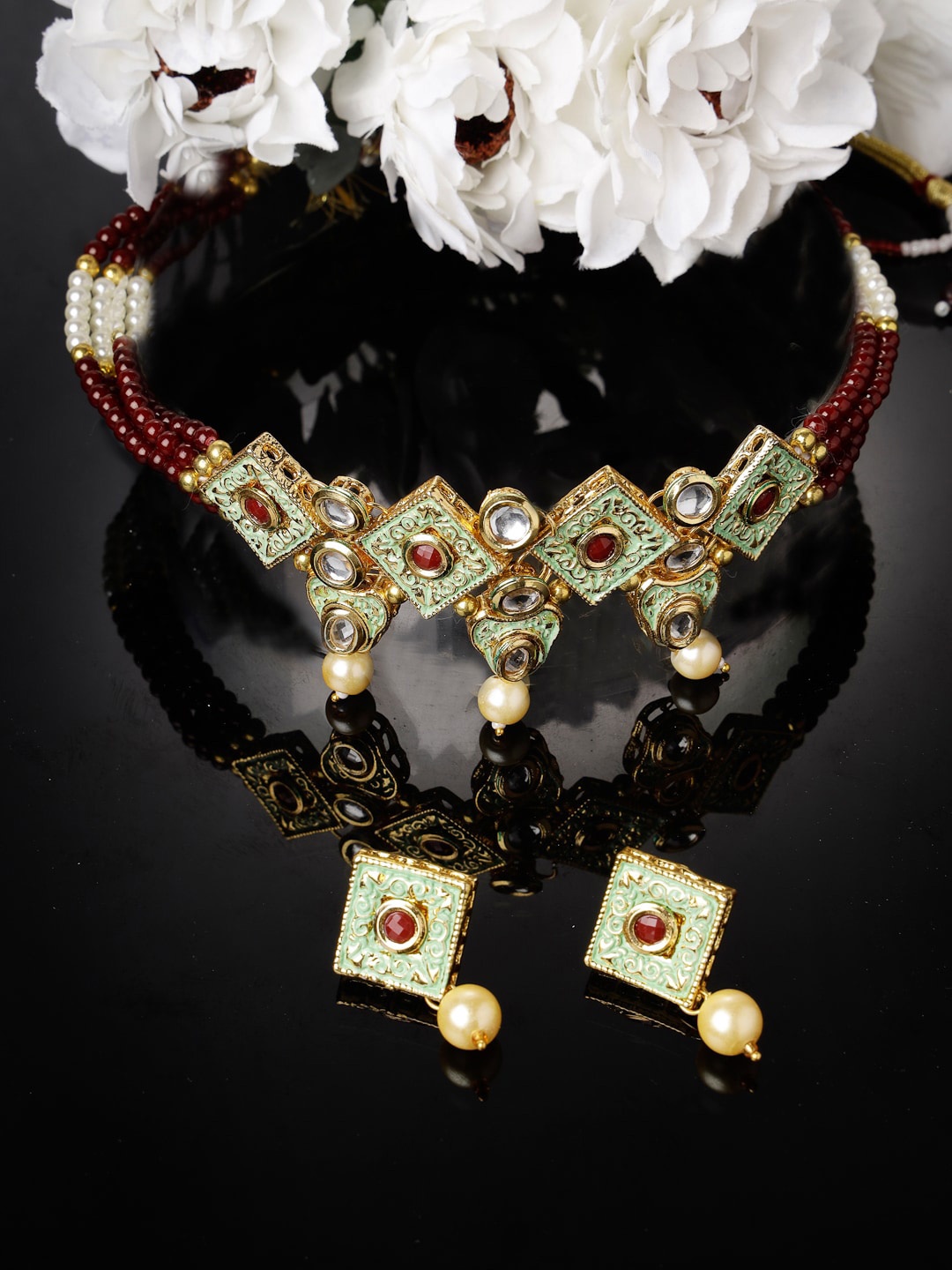 

Sukkhi Gold Plated Kundan Studded & Beaded Jewellery Set