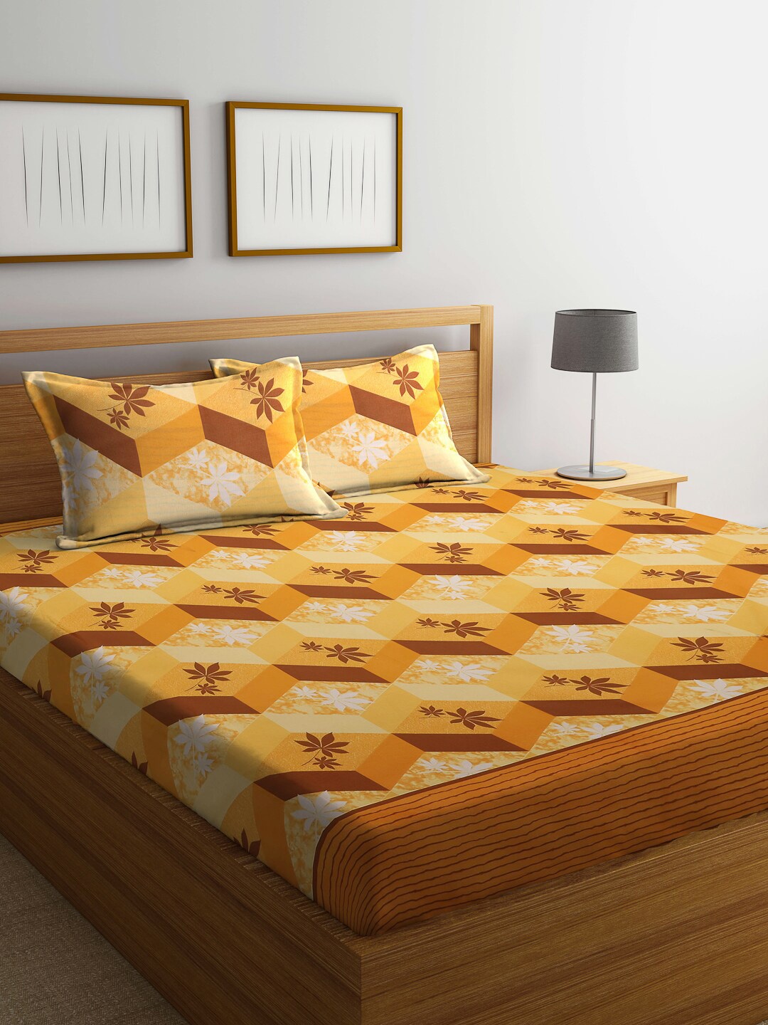 

Dhrohar Yellow & Brown Geometric Printed Cotton Queen Bedsheet With 2 Pillow Covers