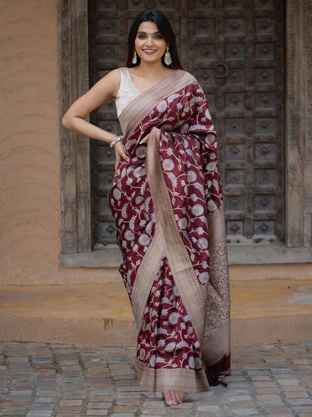 

Mitera Maroon & Gold Toned Floral Woven Design Zari Saree