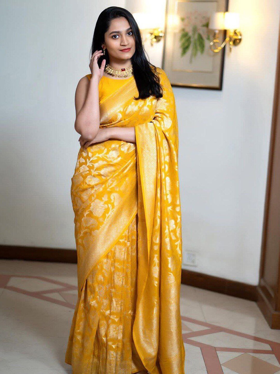 

Mitera Yellow & Gold Toned Floral Woven Design Zari Saree