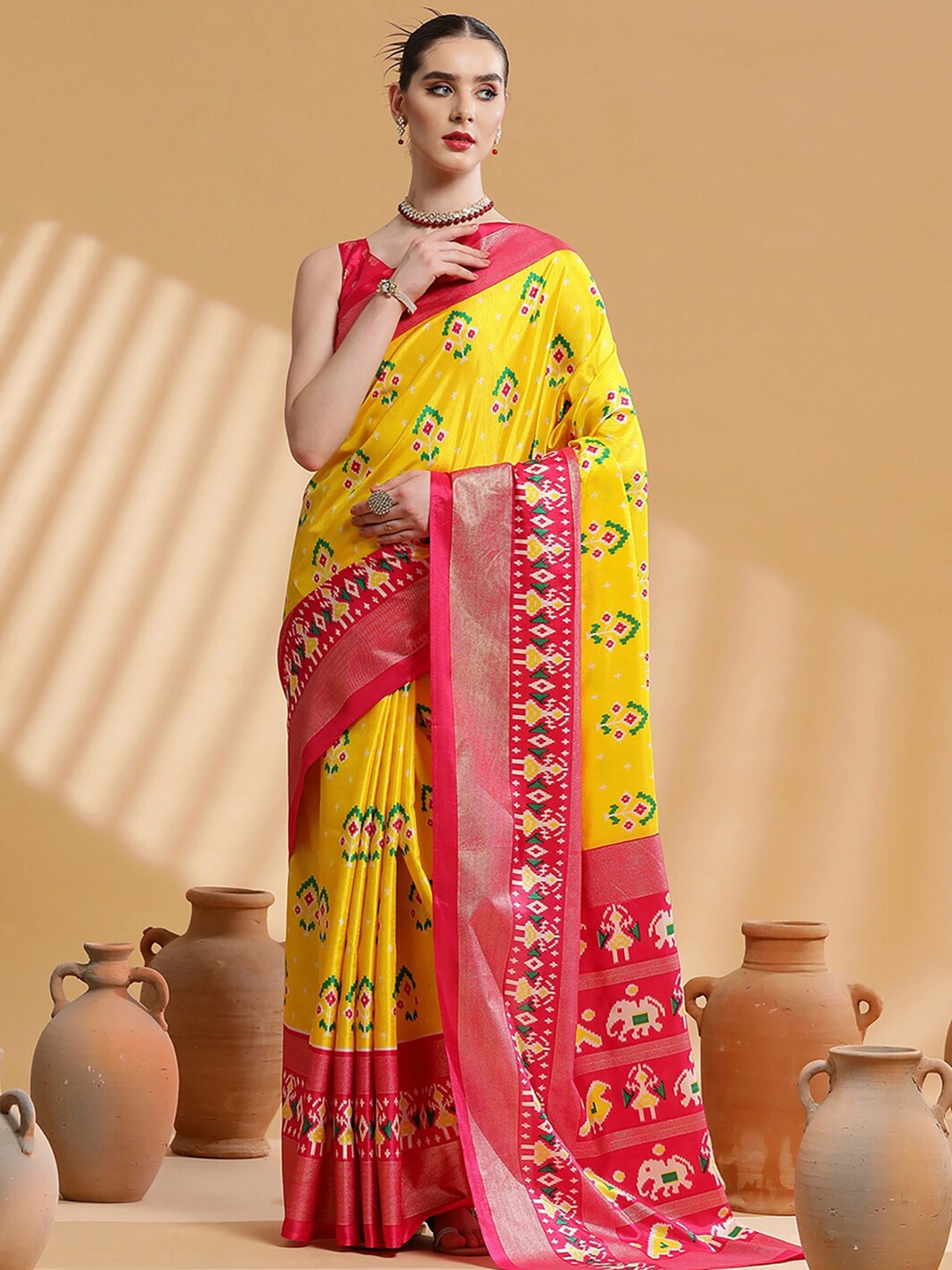 

Saree mall Yellow & Pink Ethnic Motifs Printed Zari Ikat Saree