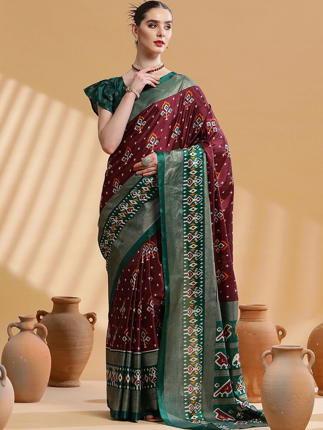 

Saree mall Brown & Green Ethnic Motifs Printed Zari Ikat Saree