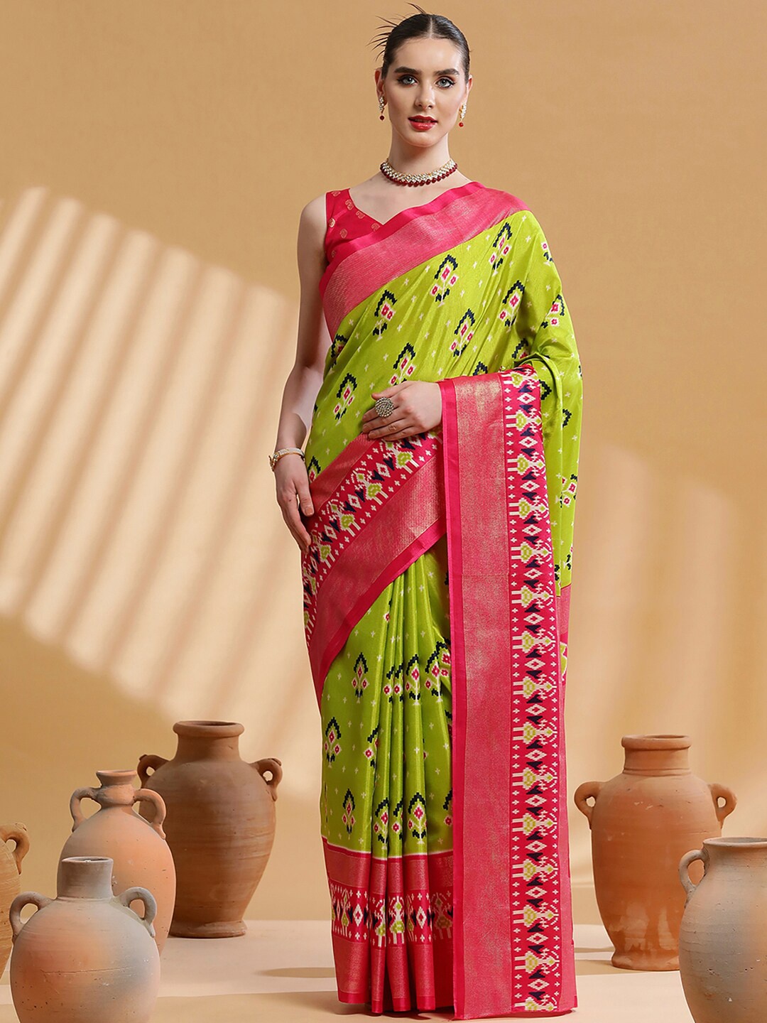 

Saree mall Green & Red Ethnic Motifs Printed Zari Ikat Saree